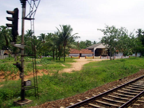 farms and buildings along the railroad