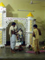 priests preparing for a puja (ceremony)