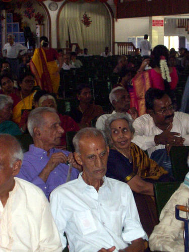 Murthy's parents (blue dress and shirt)